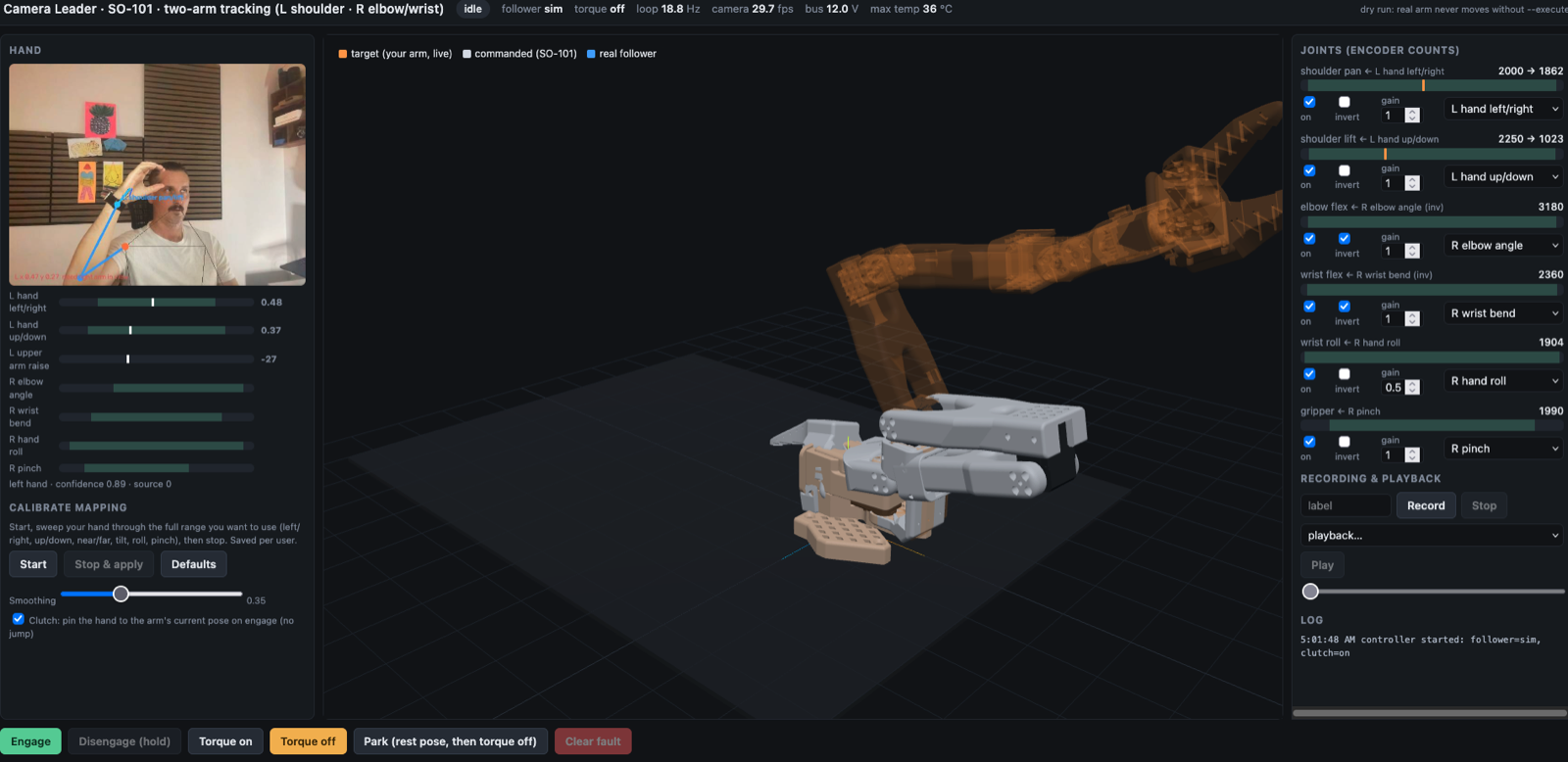 The camera leader app: my arm on the webcam (top left) driving a virtual SO-101.