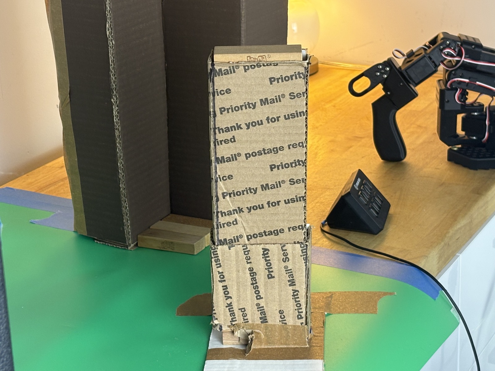 The dispenser up close, with the leader arm waiting in the background.